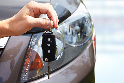 close up of person's hands holding car keys